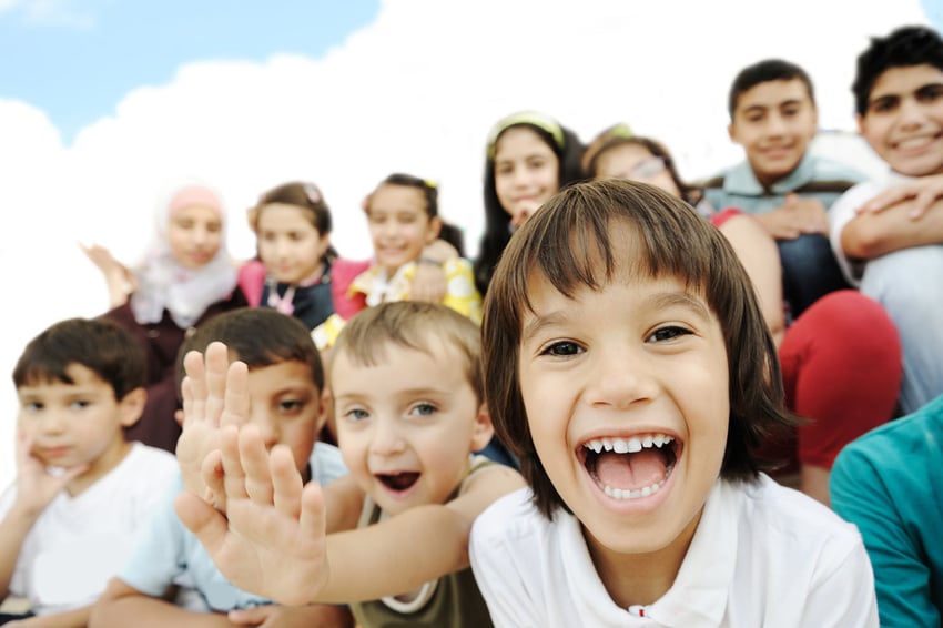 Crowd of children, sitting together happily