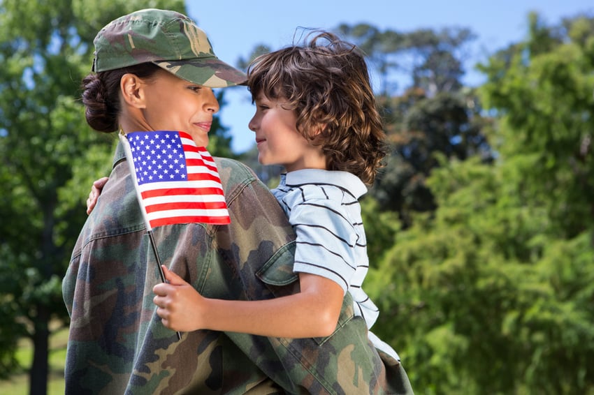 Soldier reunited with her son on a sunny day