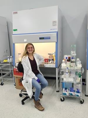 Serpin Pharma employee sitting next to lab equipment